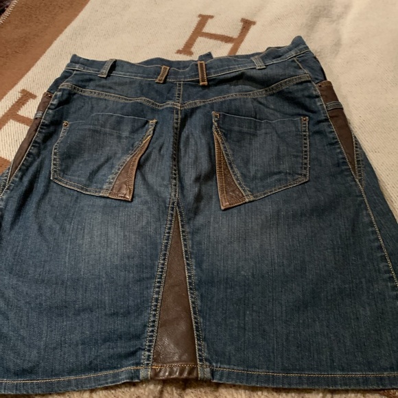 Denim and leather jean skirt. Great for stampede. 
About a size 12 - Picture 3 of 4
